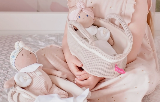 Baby Doll with Dark Skin, Brown Eyes and Knitted Carrying Cot