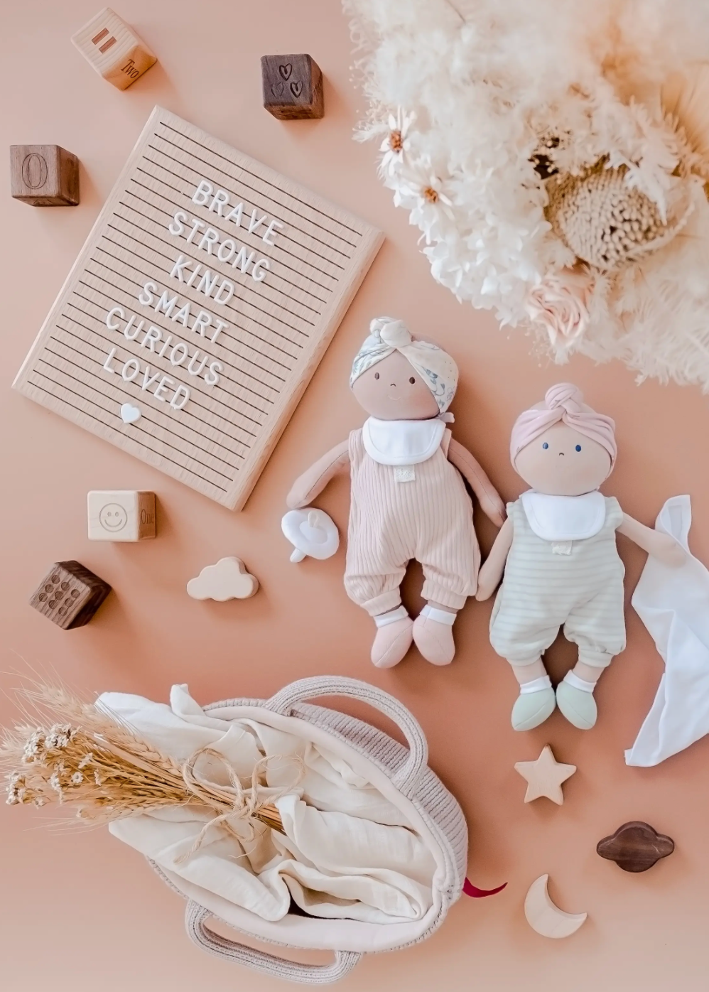 Baby Doll with Dark Skin, Brown Eyes and Knitted Carrying Cot